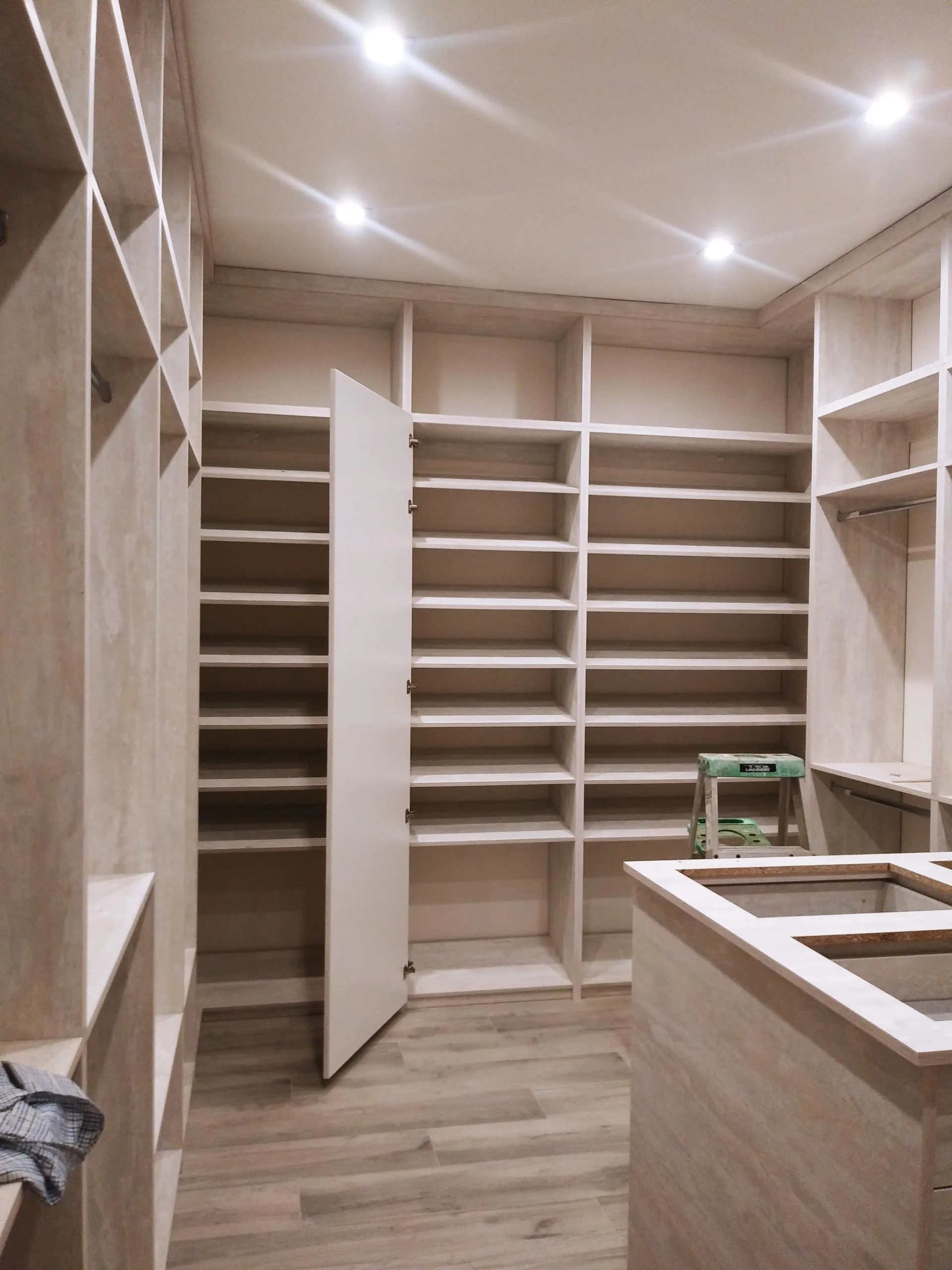 Custom gray closet with integrated storage