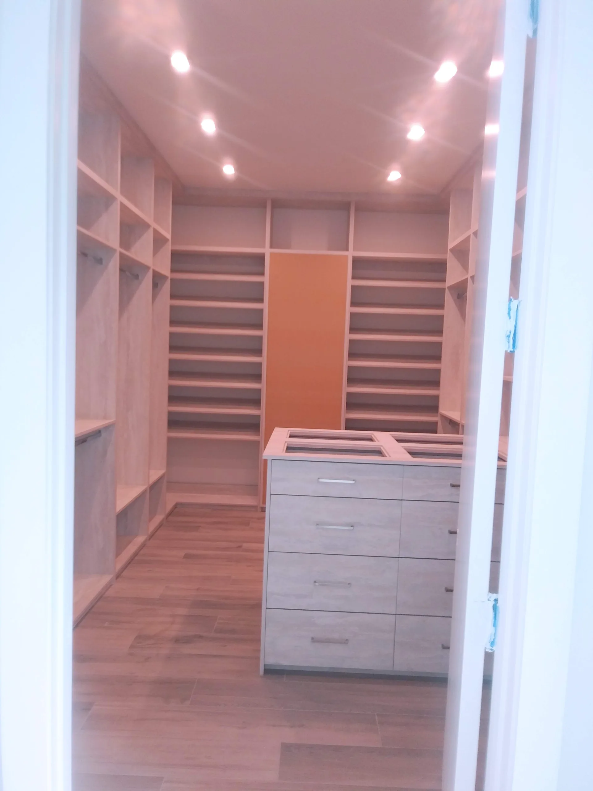 Custom gray closet with integrated storage