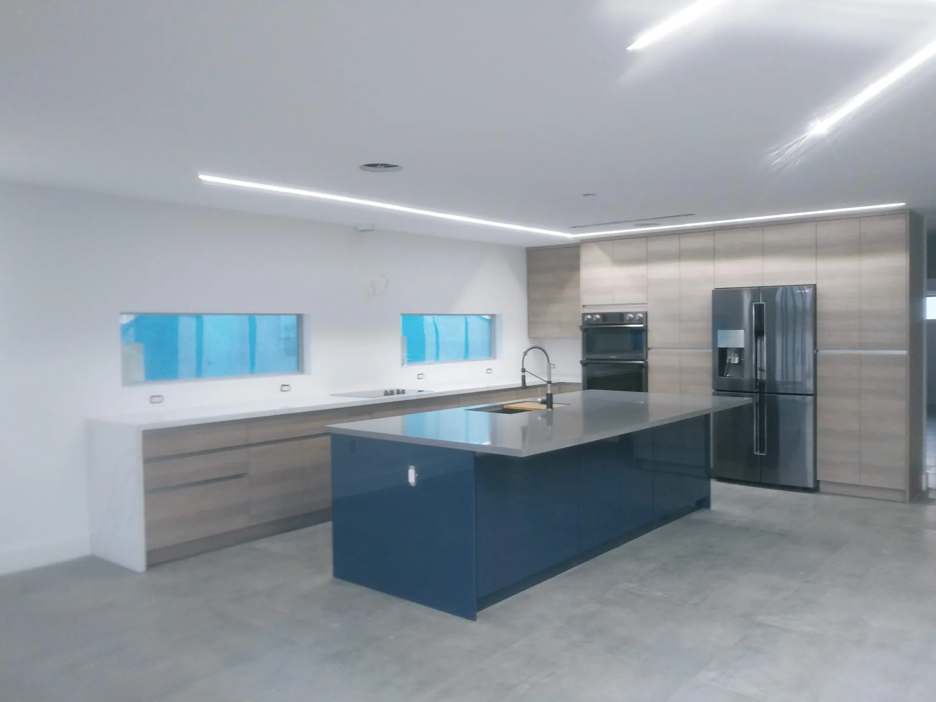 Custom kitchen with blue cabinetry