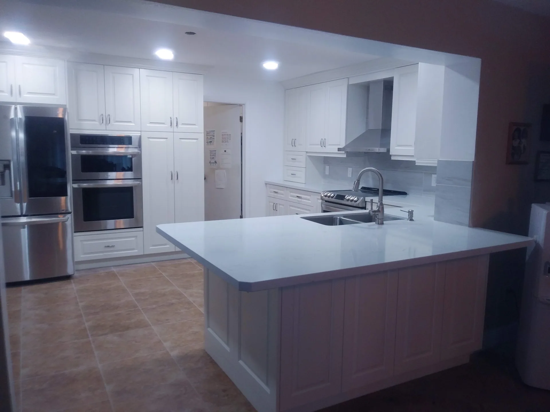 Custom white kitchen with contemporary finishes