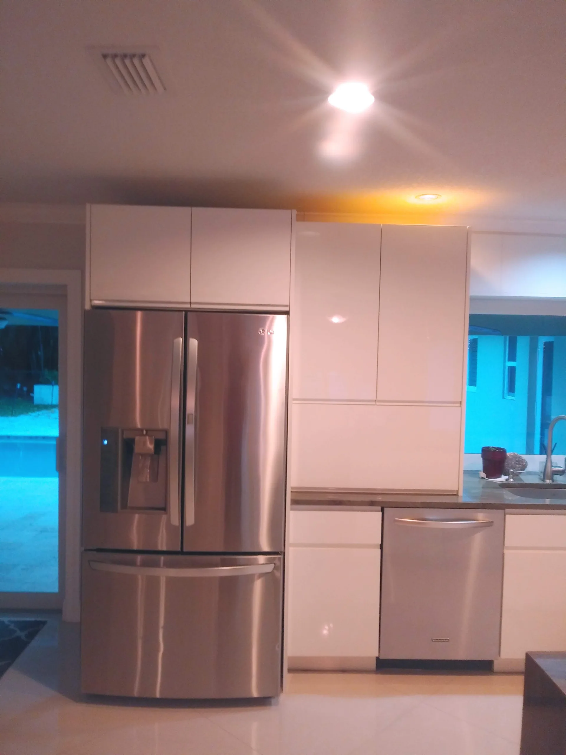 Compact kitchen with white cabinetry
