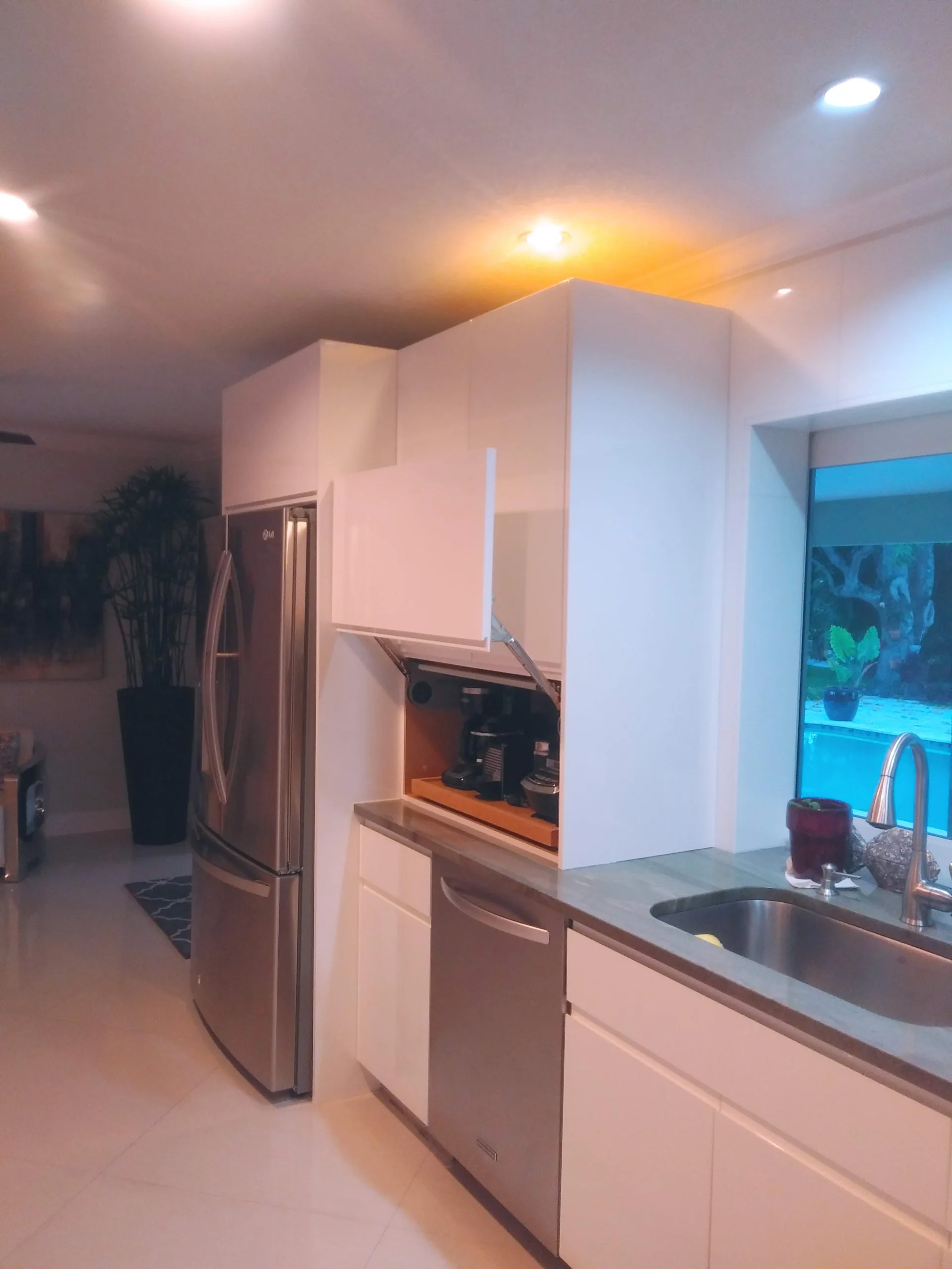 Compact kitchen with white cabinetry