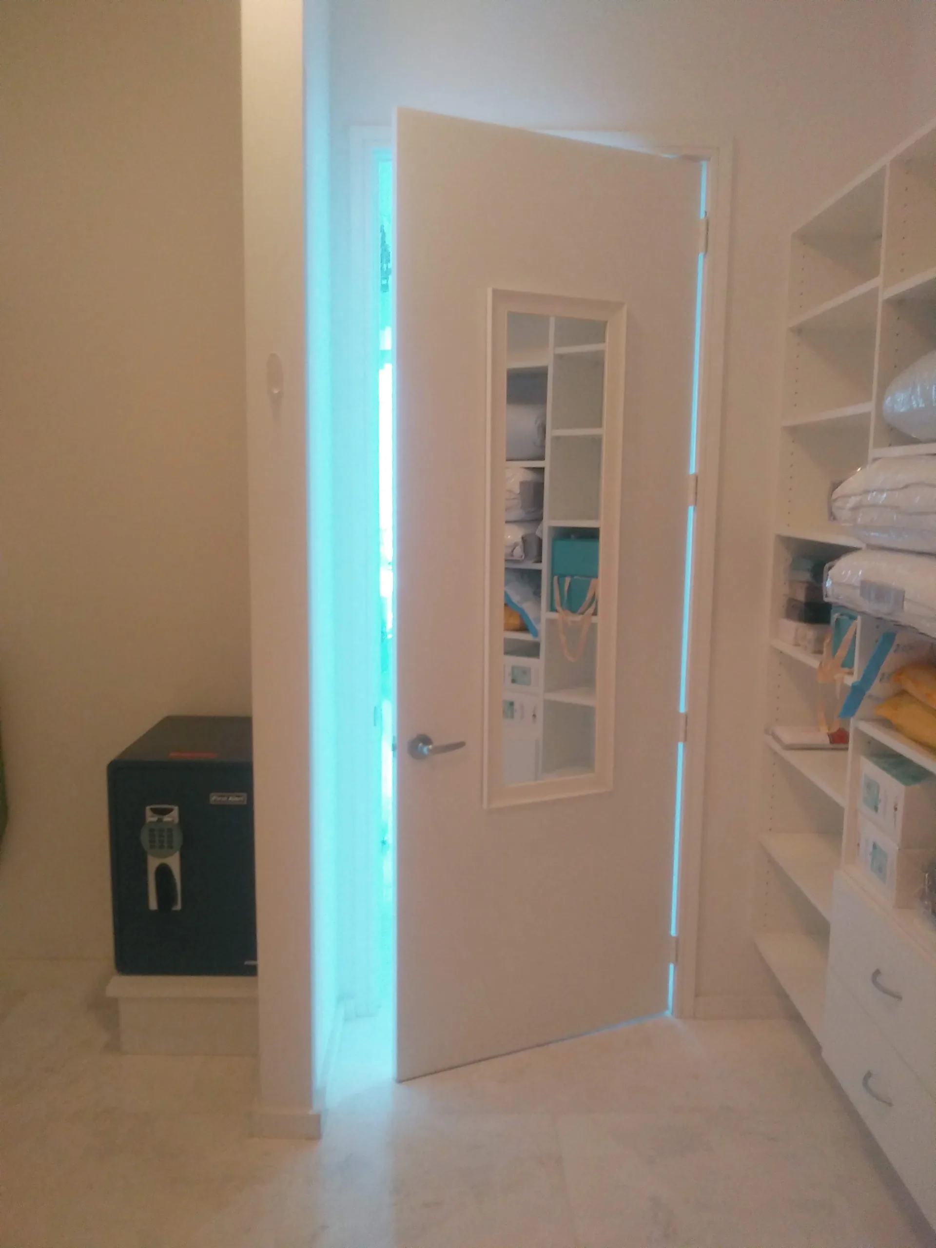 Custom white closet with shelving and hanging space