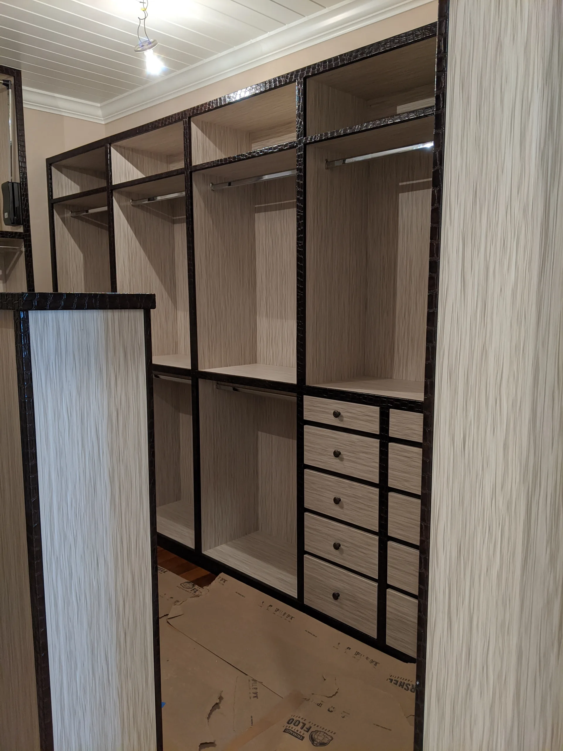 Wood closet with upholstered details