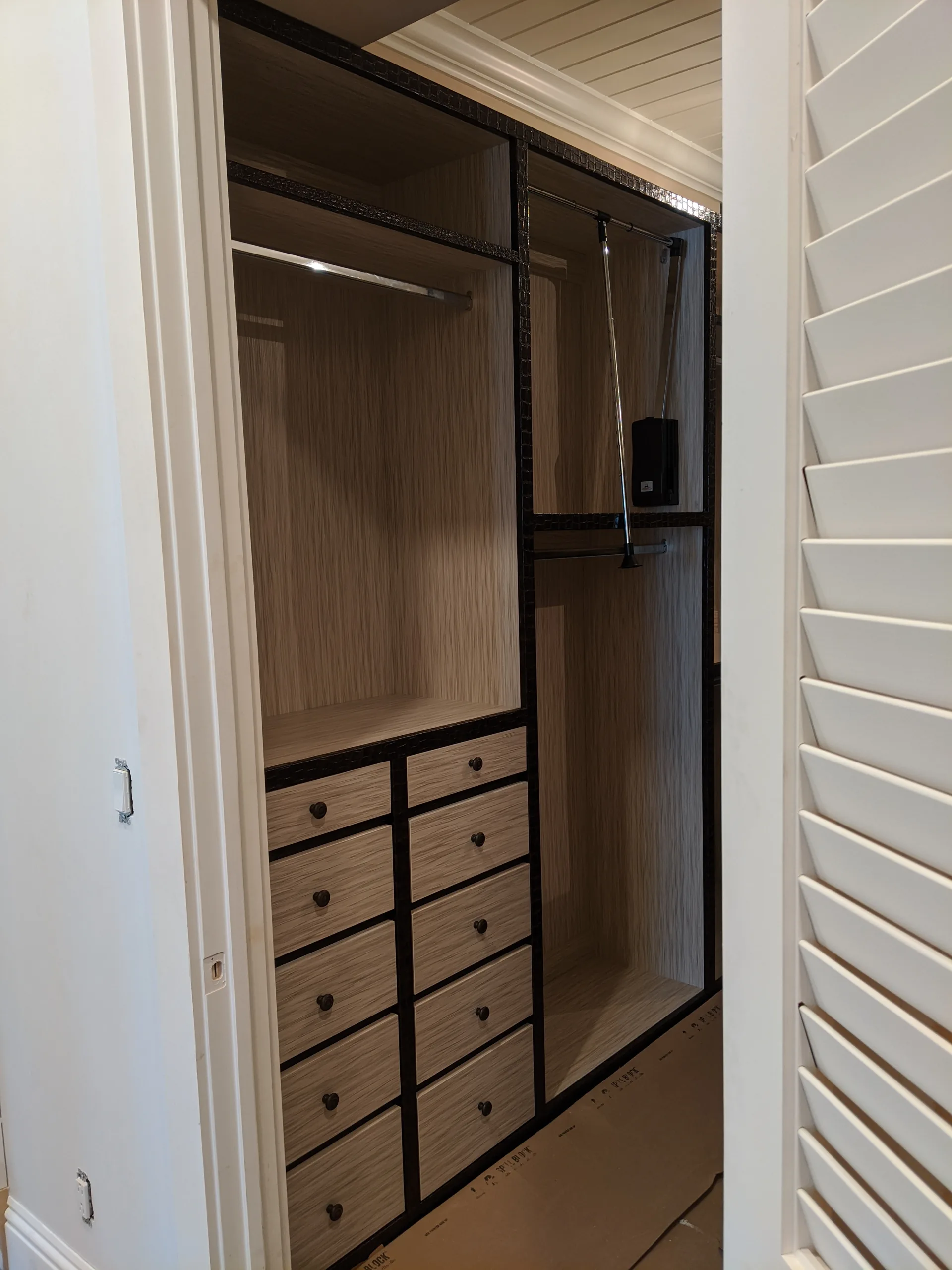 Wood closet with upholstered details