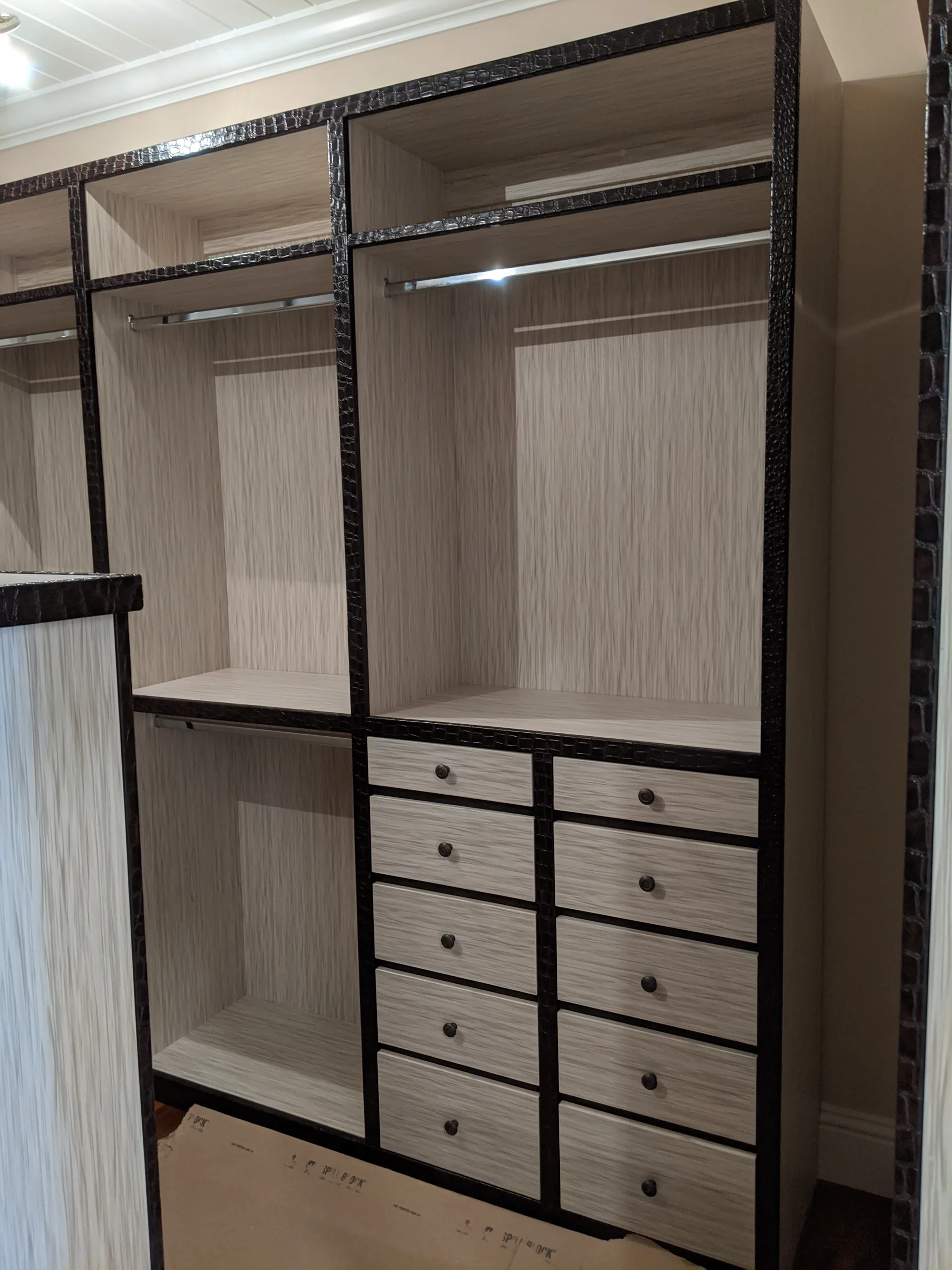 Wood closet with upholstered details